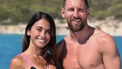 النجم ميسي وزوجته (وكالات)